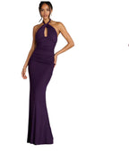 Purple evening gown on a model against a gray background