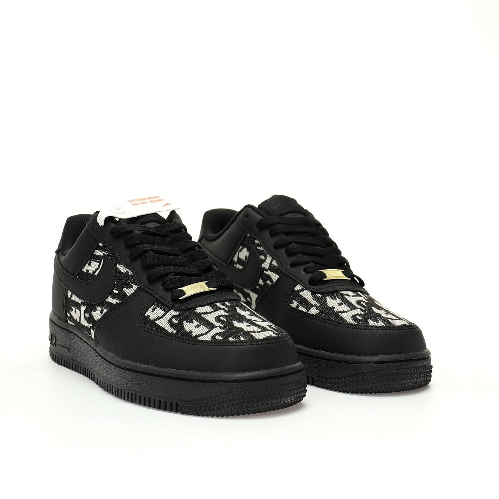 Black sneakers with white floral patterns on a white background