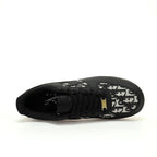 Black sneaker with white pattern on a white background