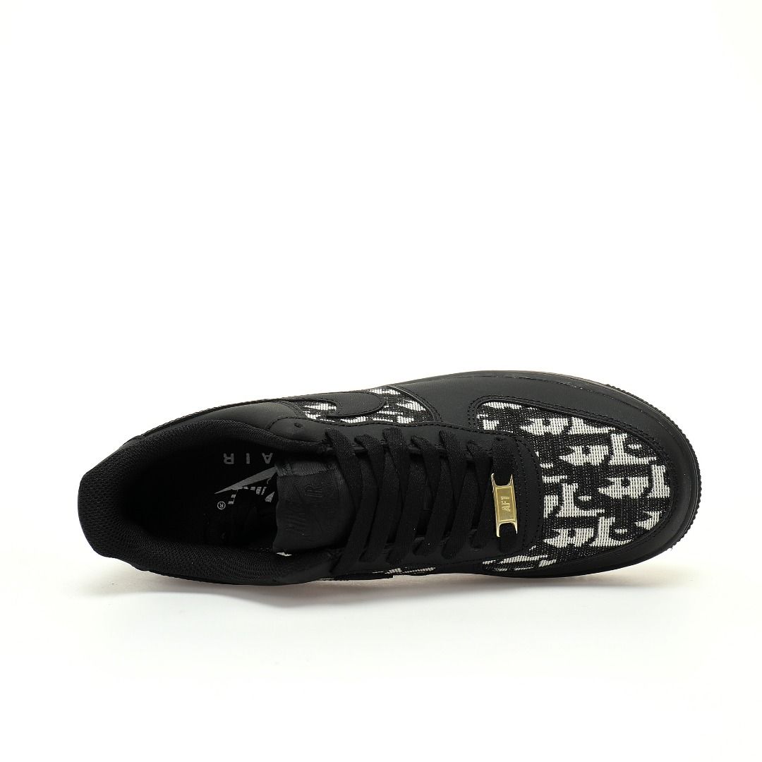 Black sneaker with white pattern on a white background