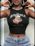 Person wearing a black crop top with 'Gangsta' graphic design and text.