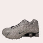 Gray sneaker with Nike logo on a light gray background