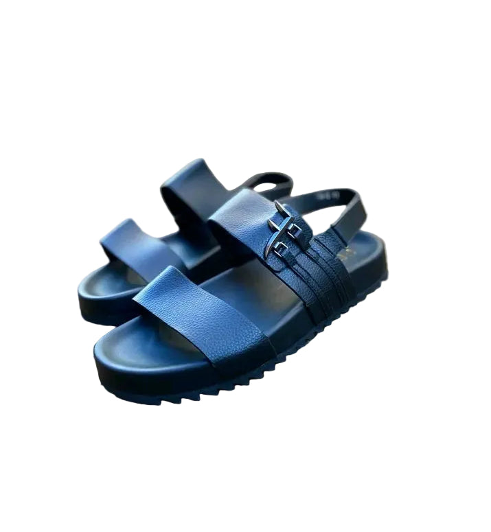 Blue sandals on a stone surface with a blurred background