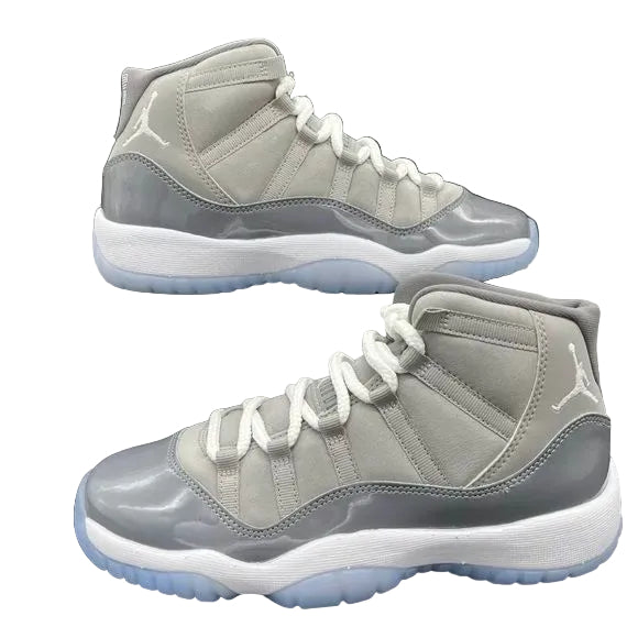 Pair of gray high-top sneakers on a black background