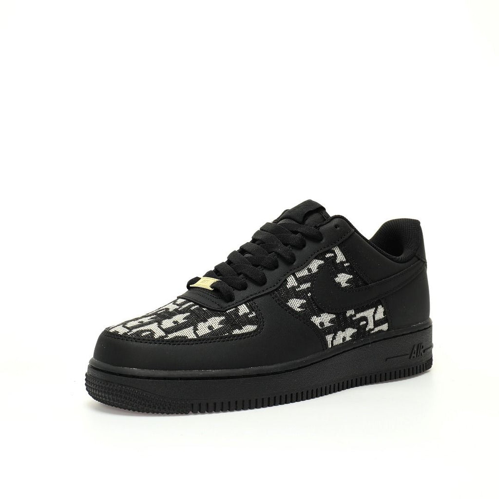 Black sneaker with white pattern on a white background