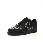 Black sneaker with white pattern on a white background
