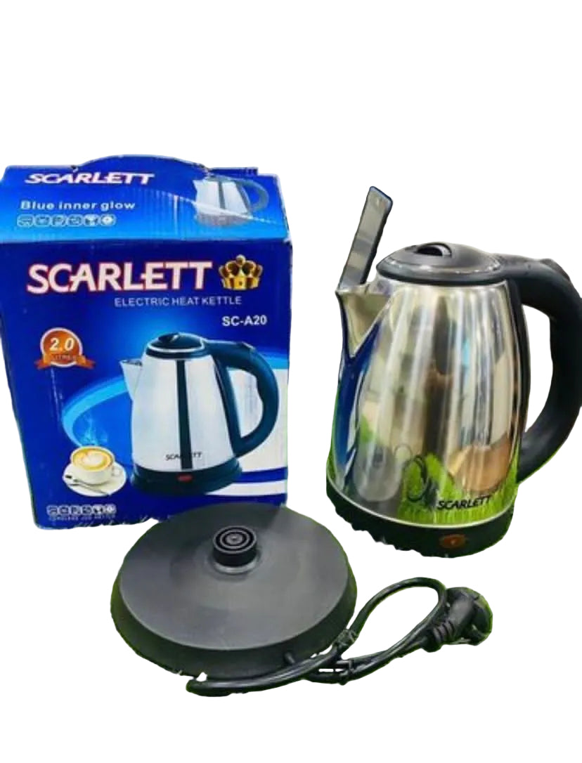 Scarlett electric kettle with packaging on a grass-like surface